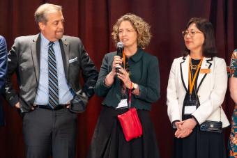 Three people on stage